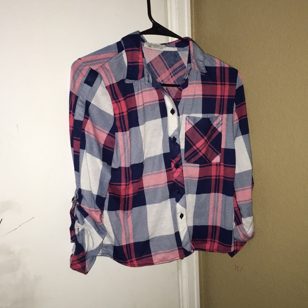 I am selling a flannel crop top button up shirt